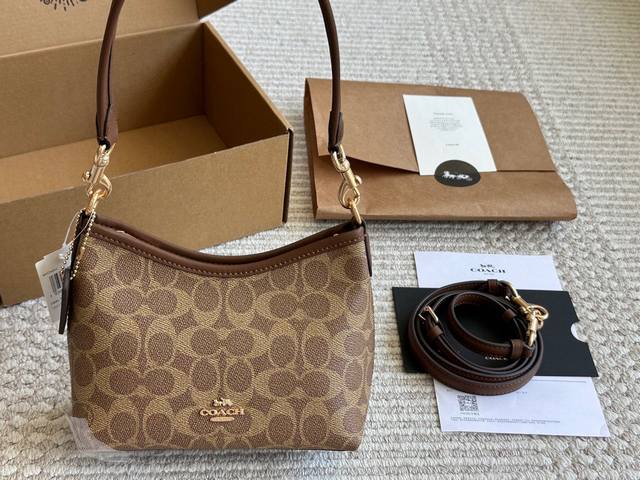 Coach. I didn't expect the mini hobo bag to be this cute. The mini hobo bag is s