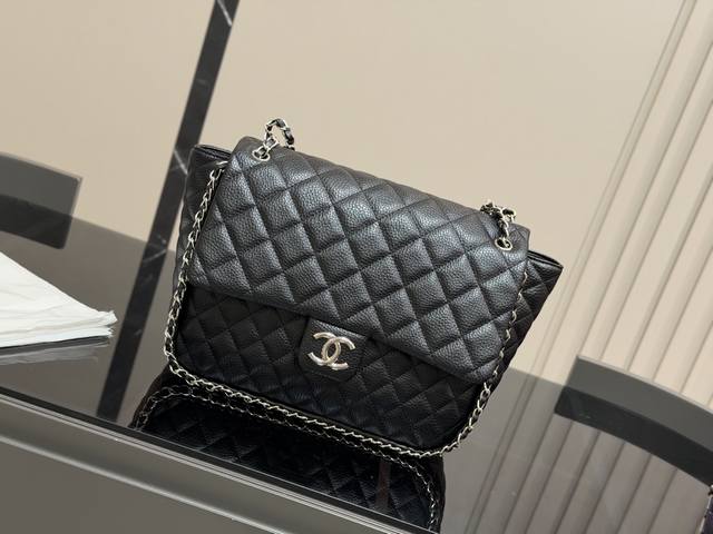 The coolest thing is Chanel's black and silver piping . This thick chain and st