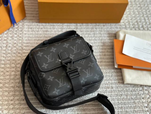 LV messenger bag . This classic black floral messenger bag is a must-have for L