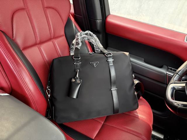 Latest high-end Prada shoulder bag. Prada messenger bag with logo and adjustable