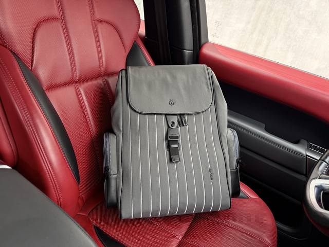 A new high-end Rimowa Never Still backpack. Large, unisex canvas backpack with b