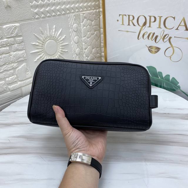 The latest and hottest Prada stainless steel combination lock clutch is now shi