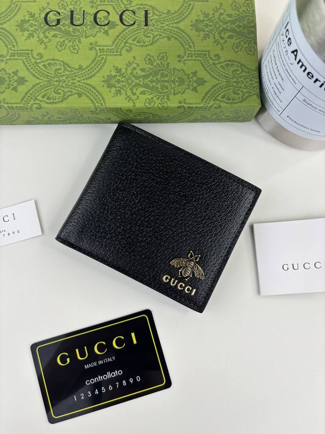 Guccl's latest Animalier short wallet features an imported bronze bee logo, pig