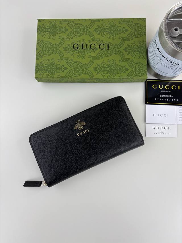 Guccl's latest Animalier zip-around wallet features an imported bronze bee logo