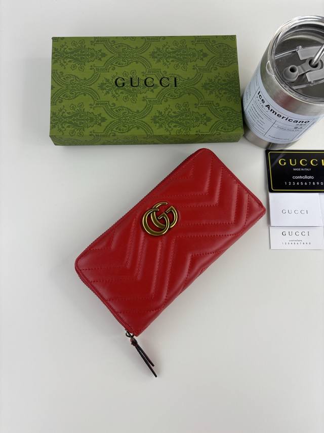 Guccl Gg Marmont long zipper wallet with quilting and Gg logo embroidered on the