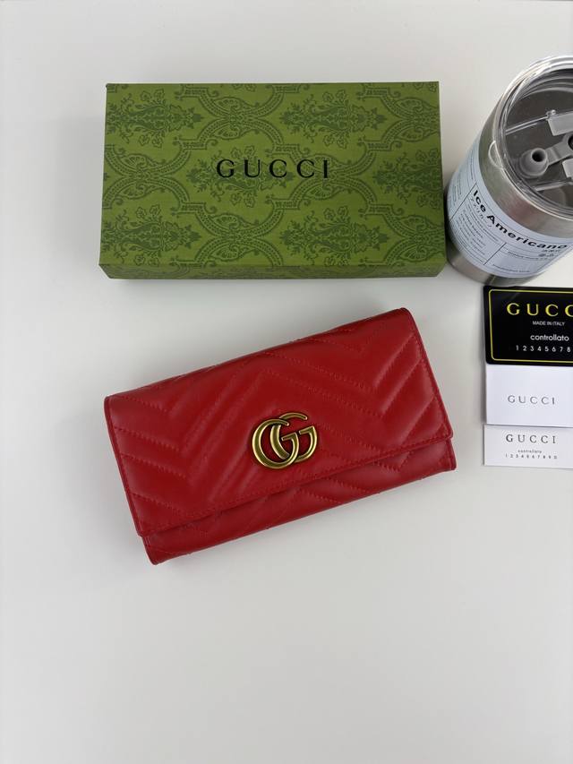 Guccl Gg Marmont long wallet crafted from quilted leather with Gg logo embroider