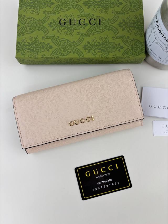 Guccl Long wallet with handwritten Gucci logo. Exploring unlimited self-expressi
