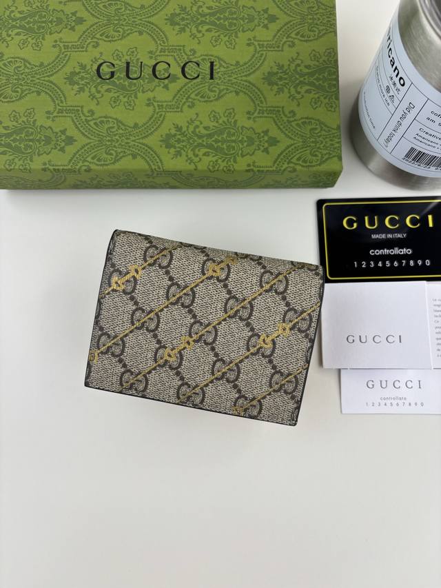 Guccl Horsebit Print Long Wallet. The iconic logo is interwoven with a unique si