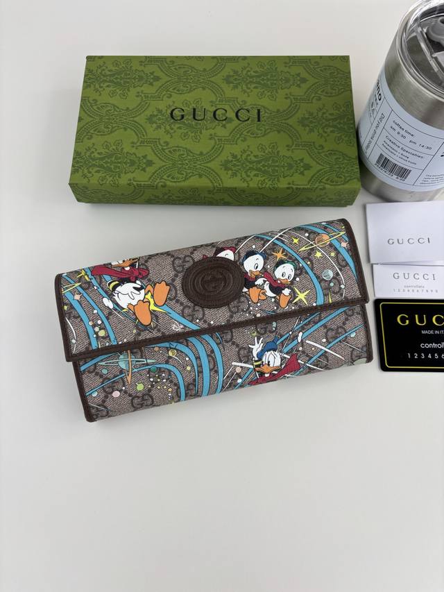 Guccl Supreme Wallet. Legendary Disney characters continue to inspire the brand
