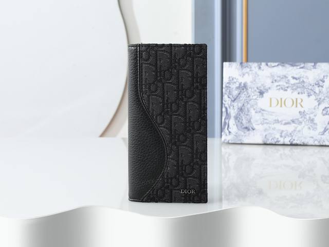 Style 330 is crafted from black cowhide leather with black and black Oblique pr