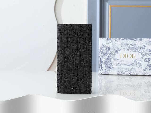 Style 002 Crafted in black with black Oblique print fabric, this long wallet fe