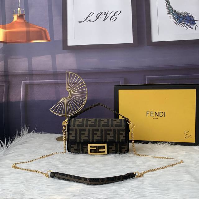 Fendi F8Bs018# The iconic Baguette mini bag features a flap and a Ff magnetic cl