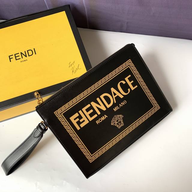 Style 7Va491 Black leather clutch with gold laminated print, decorated with the