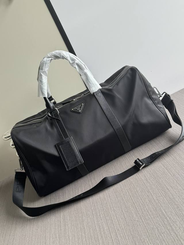 Photos, in stock. This is the latest Prada Parachute Nylon and Imported Leather