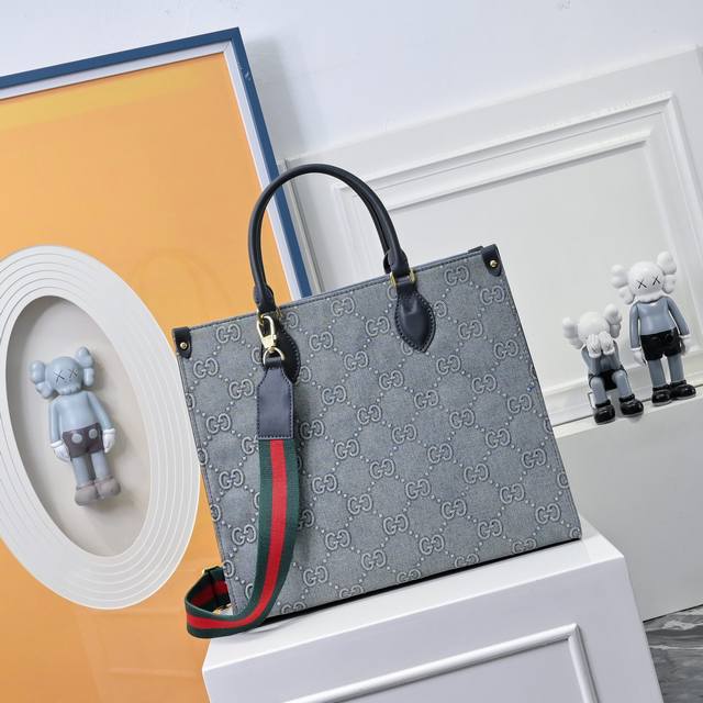 Gucci's new original denim monogram tote bag . This denim and leather design is