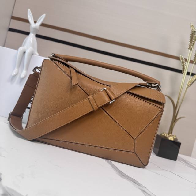 Low This new large, soft deerskin puzzle bag features a rectangular shape define