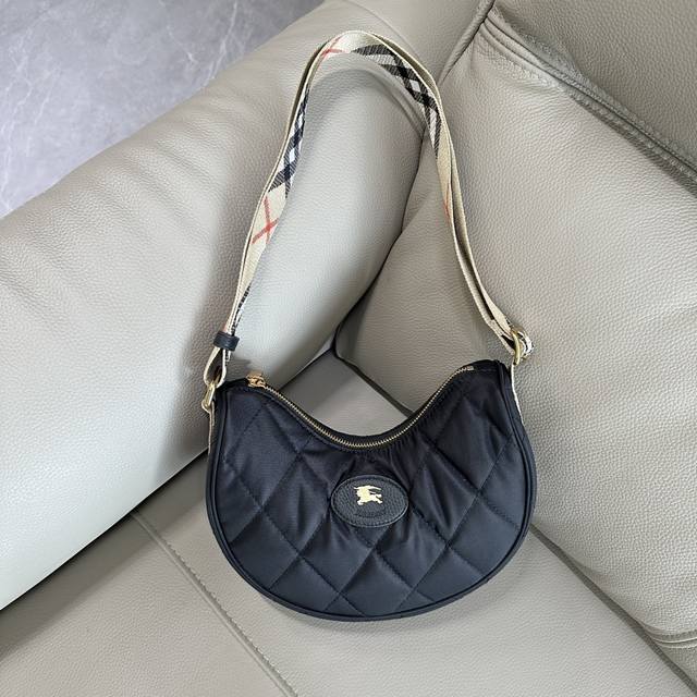 This premium version of the original Burberry Horseshoe crossbody bag draws ins