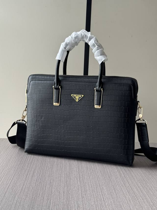 The latest and hottest Prada combination lock briefcases are shipping in bulk.