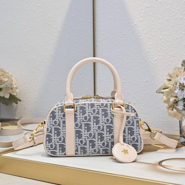 New arrival, Dior's premium original D-Vibe small bowling bag, featuring a casu
