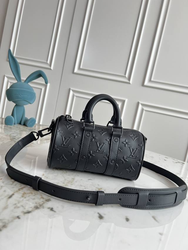 Top-grade, original M57960 black embossed pillow bag with embossed logo. This Ke