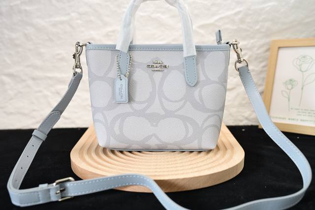 Coach's new July model, the Big C Mini City, is a small tote bag with the model