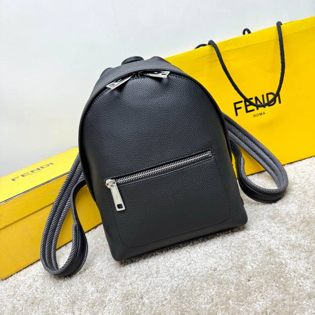 Small 3D Structured Backpack. This design features a metal rivet engraved with
