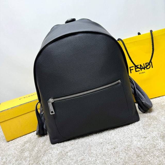 A roomy, structured backpack. This design features a metal rivet engraved with t