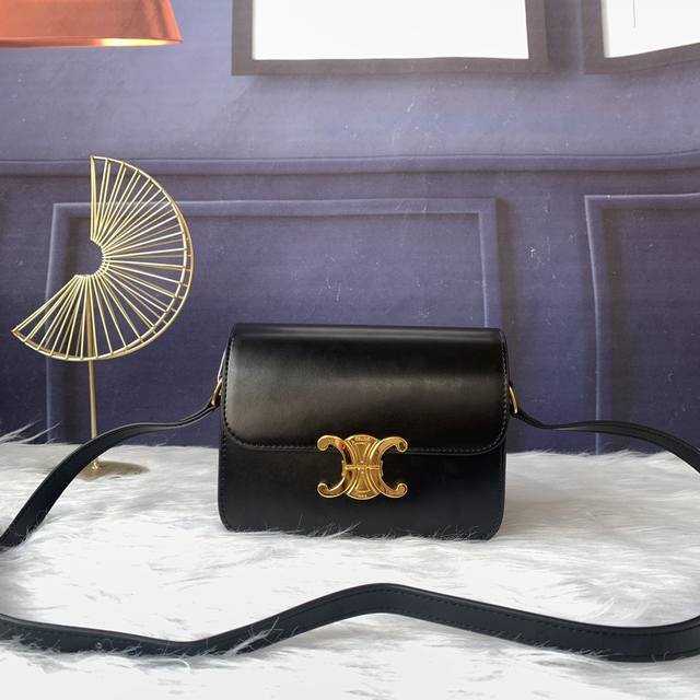 Model number C188522 Black Triomphe small handbag with an adjustable and detach