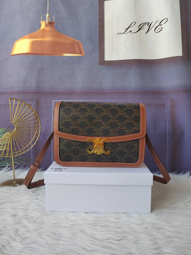 Model number C188411 Triomphe large handbag with monogram, comes with an adjust