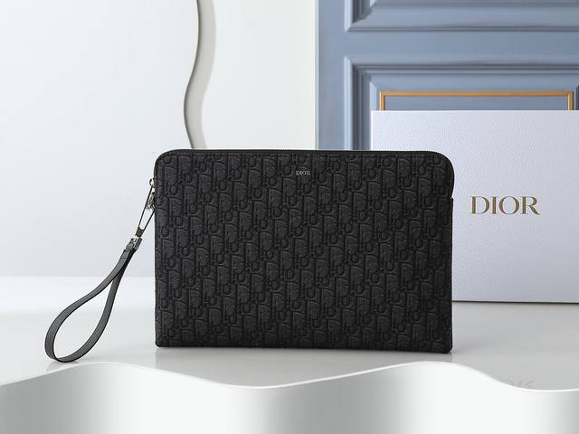 Style No. 421 Black printed fabric This A4 zipper clutch is launched by Dior. T