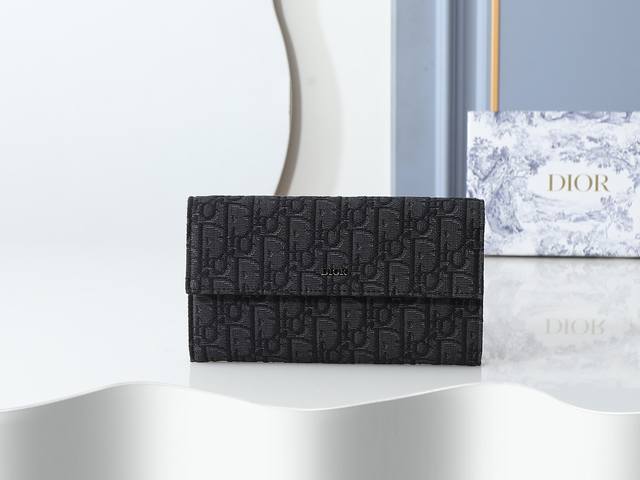 Style 312 Black printed fabric, metal Dior logo on the front, flap and central
