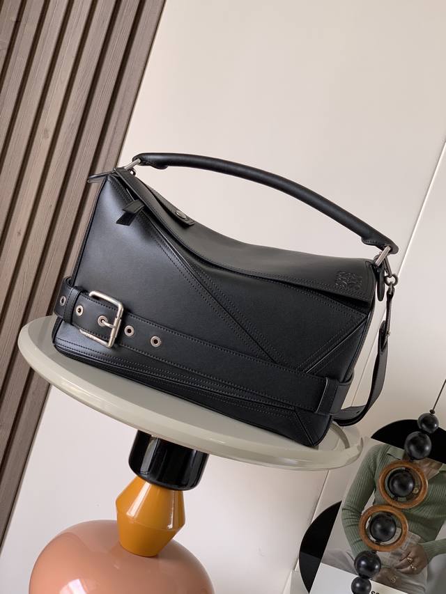 Large shiny cowhide leather puzzle Biker handbag. Distinctive geometric lines de