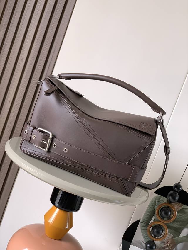 Large shiny cowhide leather puzzle Biker handbag. Distinctive geometric lines de