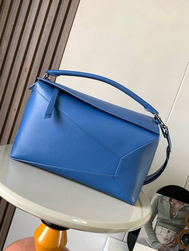 New shiny cowhide puzzle-sized handbag. The puzzle handbag is the first handbag