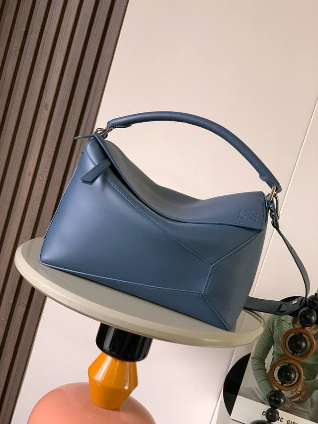 New shiny cowhide puzzle-sized handbag. The puzzle bag is the first handbag laun