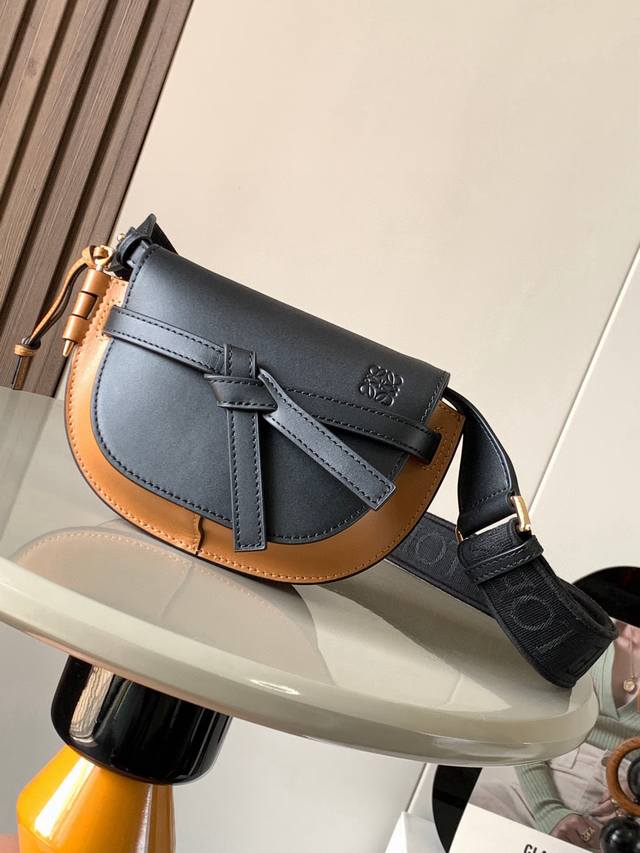 The popular mini 21cm saddle bag with new lettered wide shoulder straps. The wid