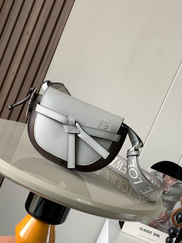 The popular mini 21cm saddle bag with new lettered wide shoulder straps. The wid