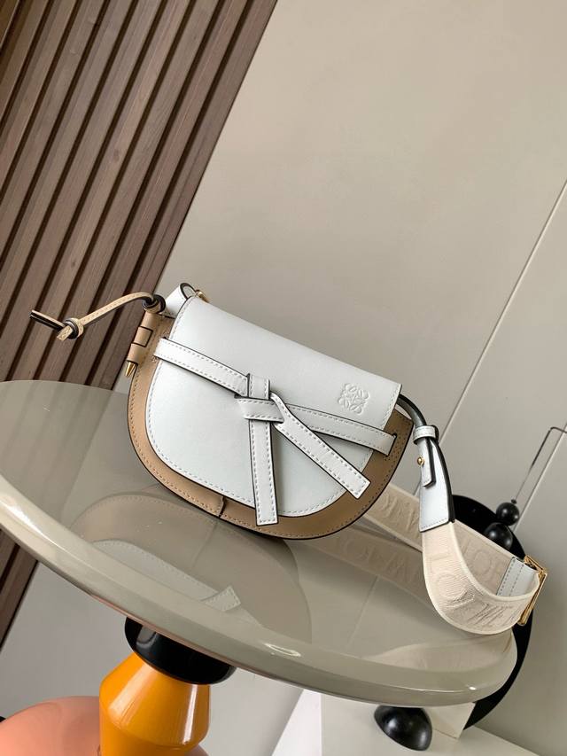 The popular mini 21cm saddle bag with a new lettered wide shoulder strap. The wi