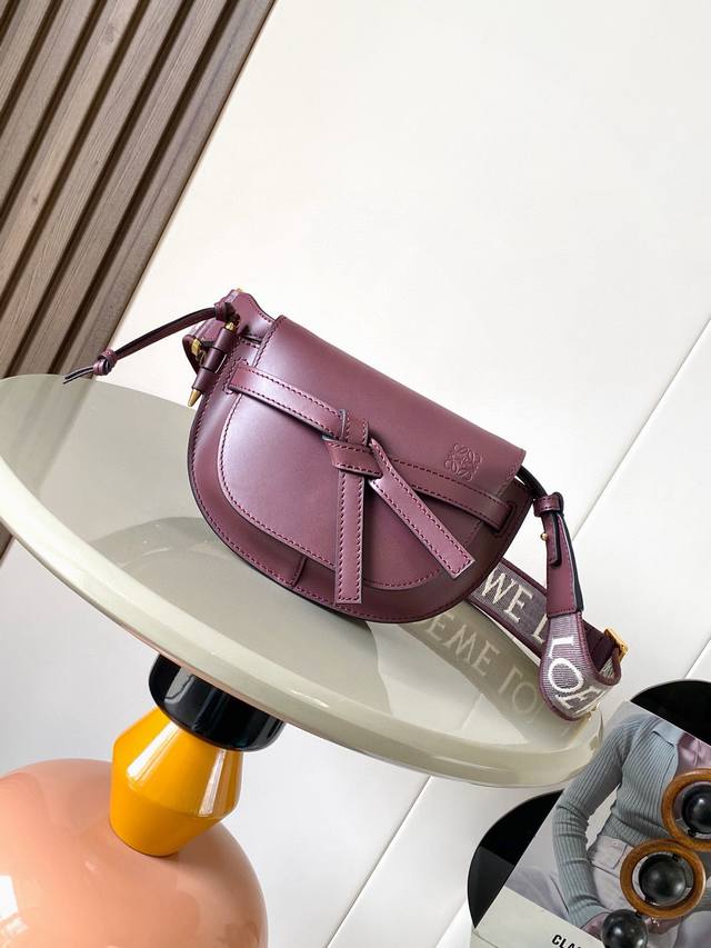 The popular mini 21cm saddle bag with a new lettered wide shoulder strap. The wi