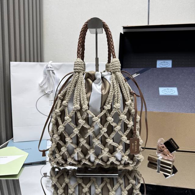 A premium, original, and new woven 1Bc111 cotton lace handbag. The nautical wor