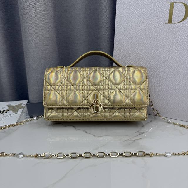 0980 Lambskin Gold Lady Dior Pearl Clutch Bag. This new season clutch features a