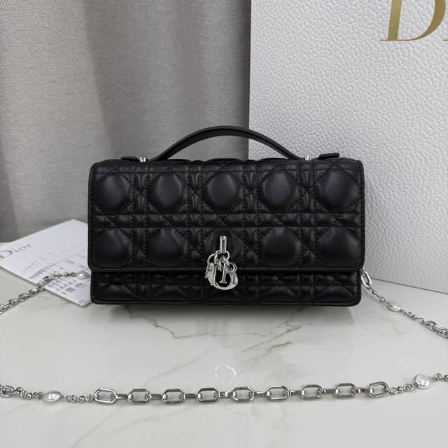 0980 Black Lambskin Lady Dior Pearl Clutch Bag. This new season clutch features