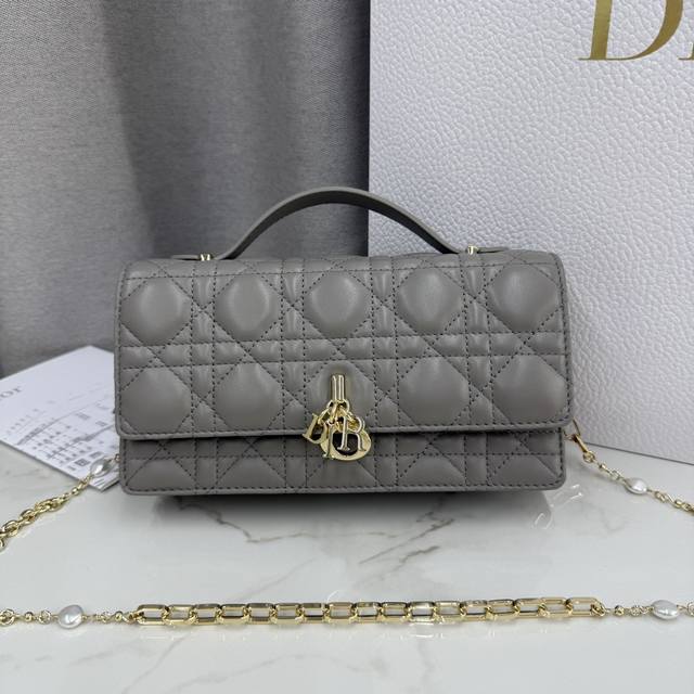 0980 Lambskin Grey Lady Dior Pearl Clutch Bag. This new season clutch features a