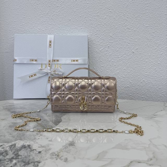 0980 Lambskin Champagne Lady Dior Pearl Clutch Bag. This new season clutch featu