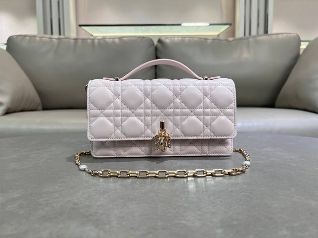 0980 Light Pink Lambskin Lady Dior Pearl Clutch Bag. This new season clutch feat