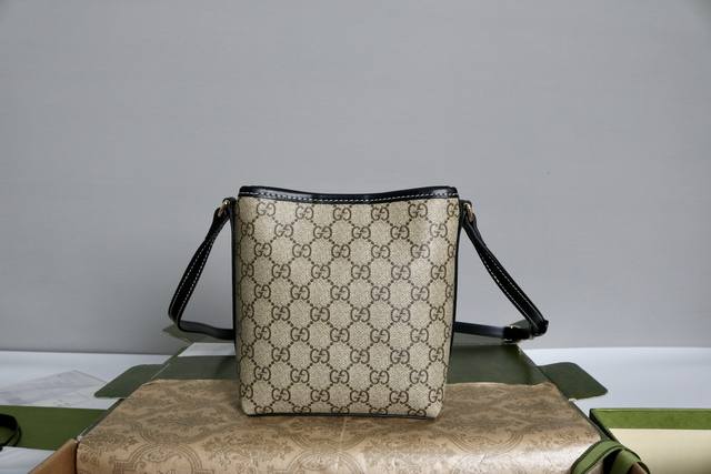 (Large Quantity Price) Description: Gg Emblem series slim bucket bag. From the