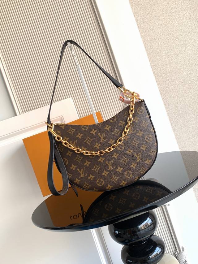 Premium Dynamic Chip Handbag is crafted from coated canvas, with contrasting lea