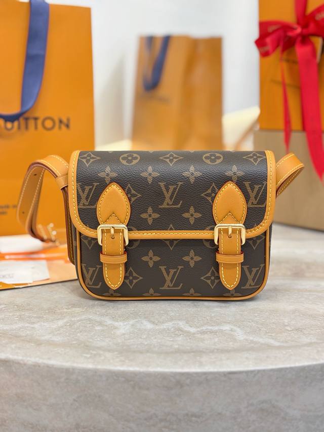 M26805 This Satchel mini handbag is from the Monogram Archive collection, featur