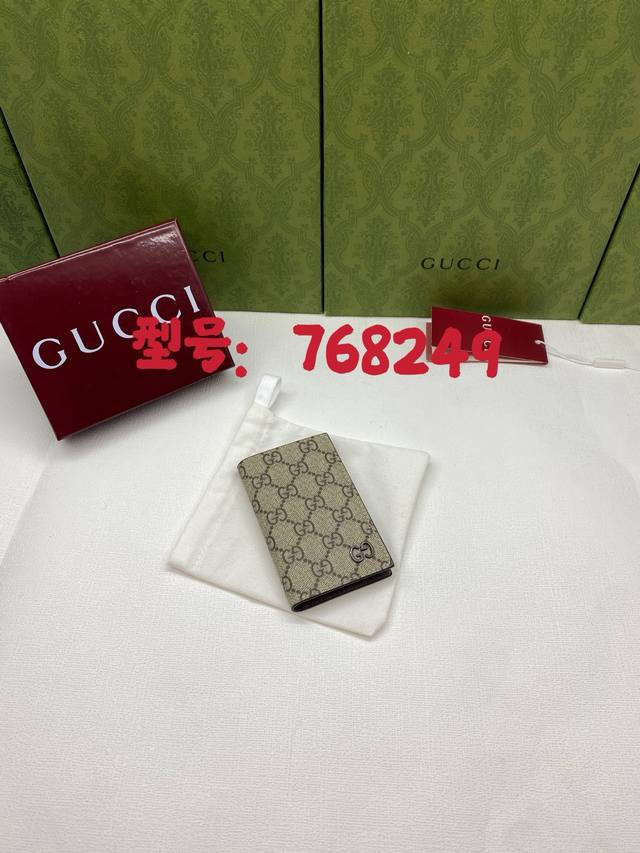 Premium genuine leather Gg long card holder with Gg details, packaged in a red b