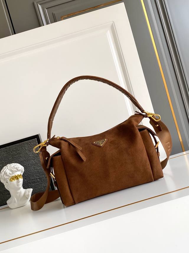 New Suede Explorer Bag This explorer bag is crafted from imported suede, featuri